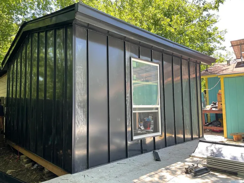 Black standing seam metal wall panels for Roof Inspection in Council Bluffs